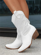 The Mary Stacy - Suede Western Ankle Boots with Perforation combine classic western style with contemporary flair.