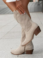 The Mary Stacy - Suede Western Ankle Boots with Perforation combine classic western style with contemporary flair.