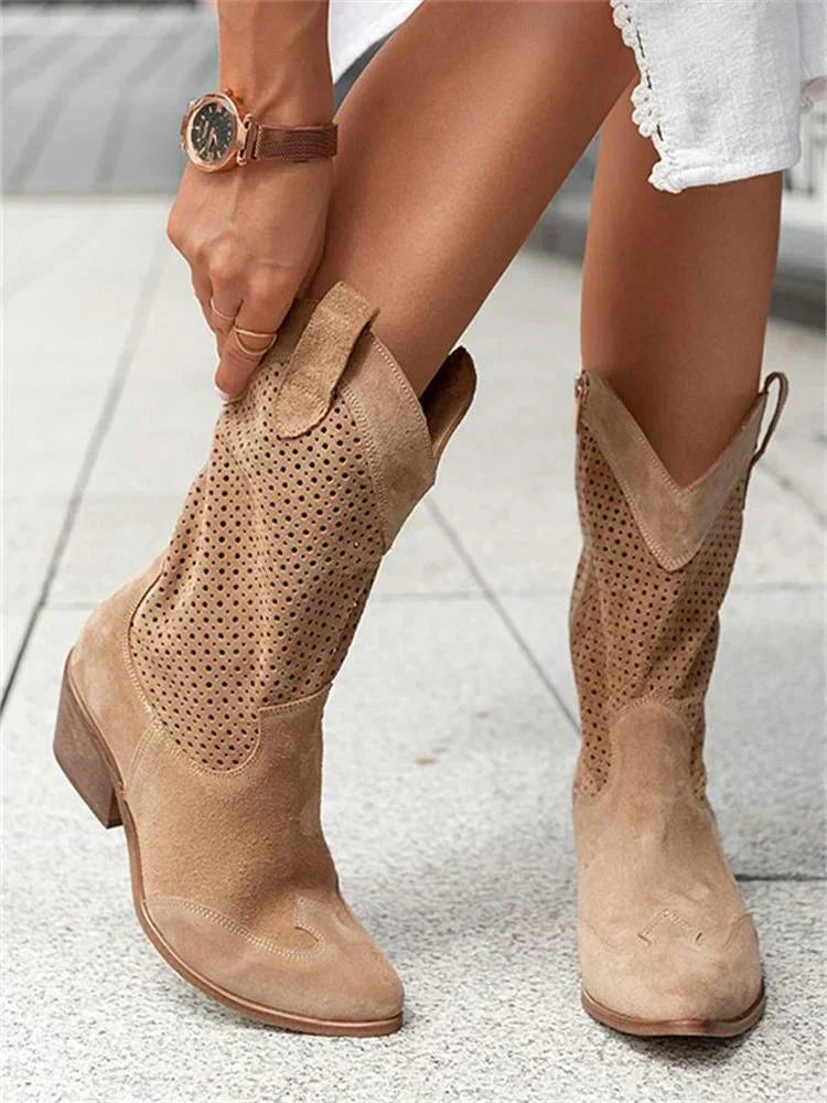 The Mary Stacy - Suede Western Ankle Boots with Perforation combine classic western style with contemporary flair.