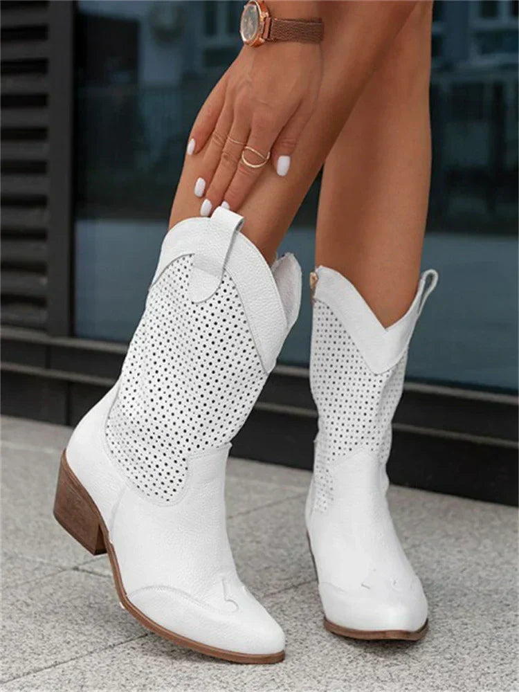 The Mary Stacy - Suede Western Ankle Boots with Perforation combine classic western style with contemporary flair.