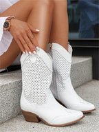 The Mary Stacy - Suede Western Ankle Boots with Perforation combine classic western style with contemporary flair.